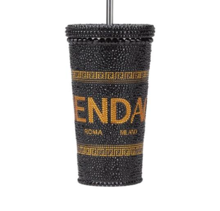 Part of the Fendi x Versace collaboration, the Black Metal Logo Travel Cup consists of a metal cup base covered in black crystals, setting the background for the Fendace Logo, which is portrayed through the placement of gold crystals, which form the final shape. Brand new and very rare item.